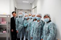 The delegates (in protective gowns) visit our Animal Holding Core